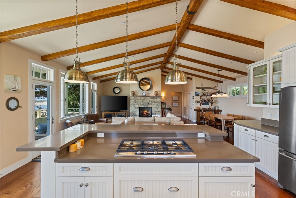 281 Main Street Morro Bay, CA 93442 - Photo 16 of 69 a kitchen with stainless steel appliances granite countertop a stove and white cabinets
