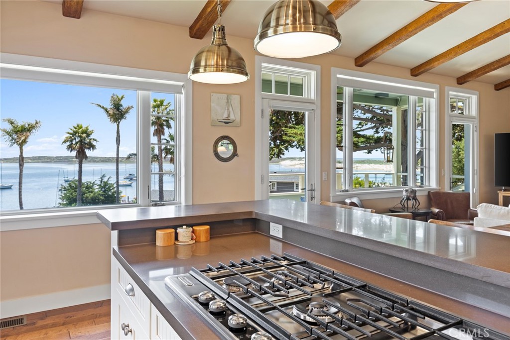281 Main Street Morro Bay, CA 93442 - Photo 18 of 69 a large kitchen with a stove a sink and a window