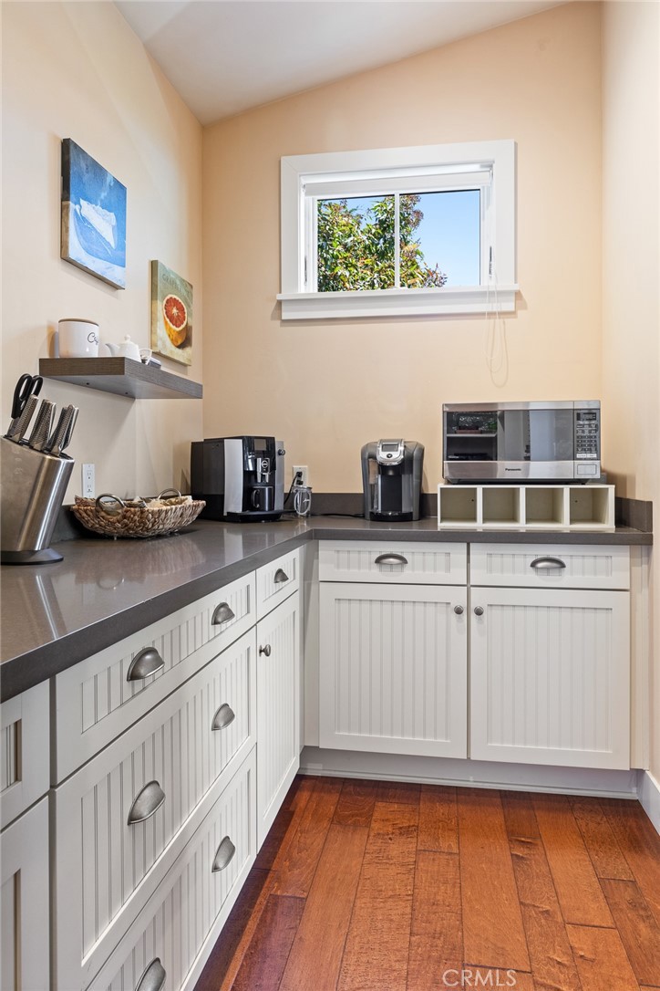 281 Main Street Morro Bay, CA 93442 - Photo 30 of 69 a kitchen with stainless steel appliances granite countertop a sink and cabinets
