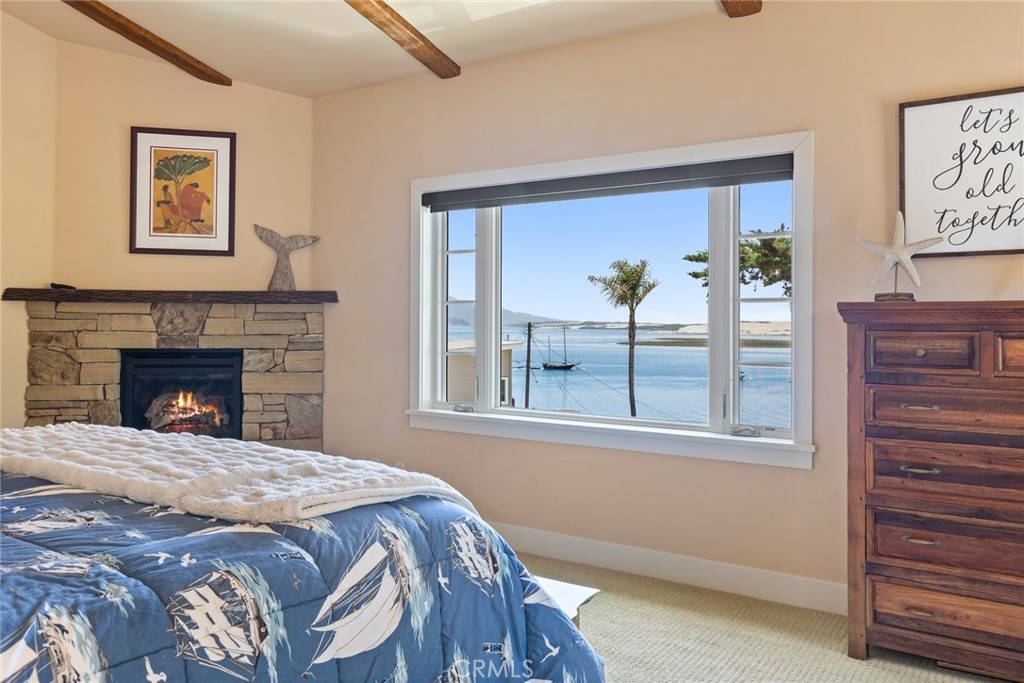 281 Main Street Morro Bay, CA 93442 - Photo 39 of 69 a bed sitting in a bedroom next to a window
