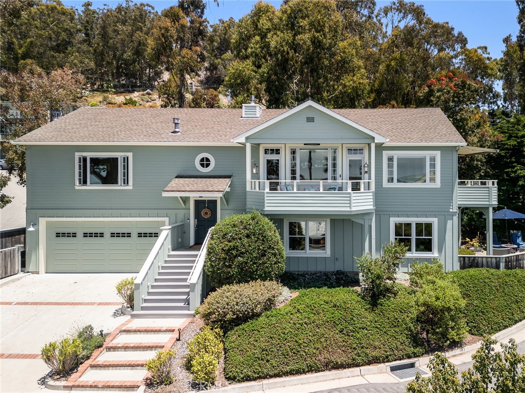 281 Main Street Morro Bay, CA 93442 - Photo 4 of 69 a front view of a house with a yard