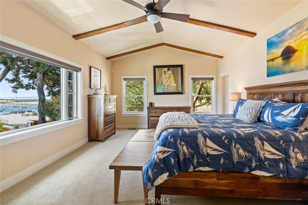 281 Main Street Morro Bay, CA 93442 - Photo 44 of 69 a bed sitting in a bedroom next to a window