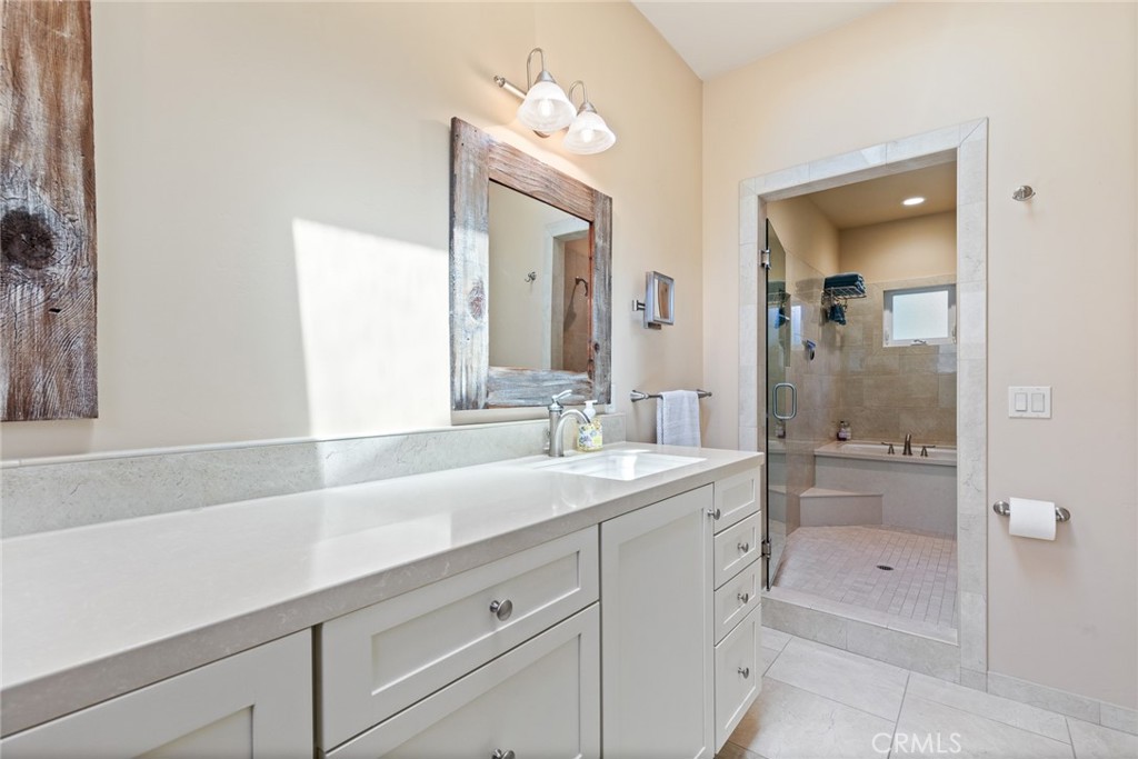 281 Main Street Morro Bay, CA 93442 - Photo 46 of 69 a bathroom with a sink a shower and a mirror