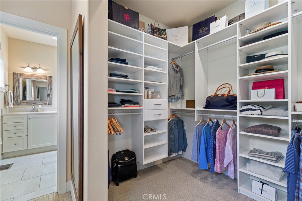 281 Main Street Morro Bay, CA 93442 - Photo 51 of 69 a view of walk in closet with clothes and shoes