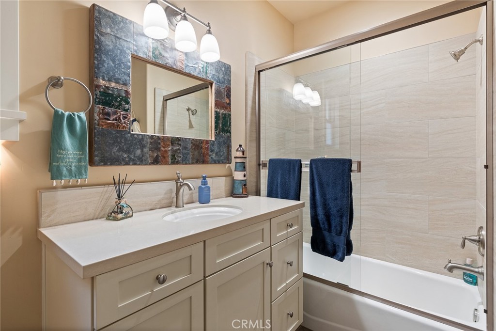 281 Main Street Morro Bay, CA 93442 - Photo 56 of 69 a bathroom with a sink and a mirror