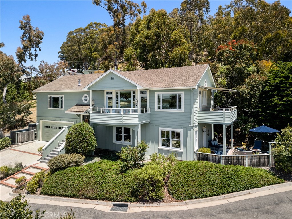 281 Main Street Morro Bay, CA 93442 - Photo 6 of 69 a front view of a house with a garden