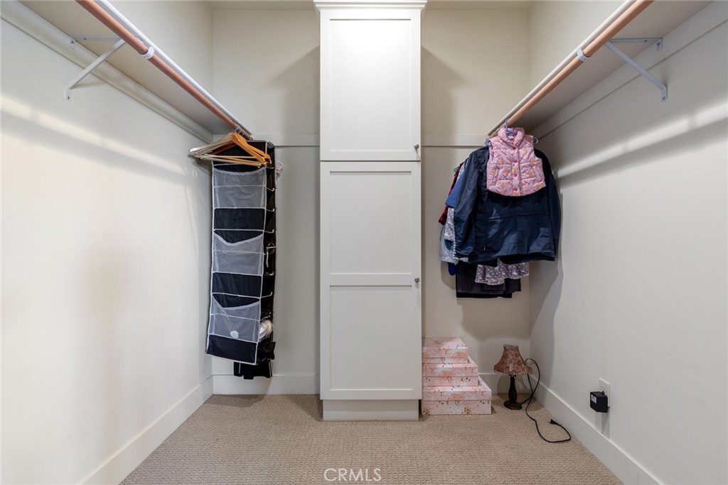 281 Main Street Morro Bay, CA 93442 - Photo 64 of 69 a view of walk in closet with clothes and shoes