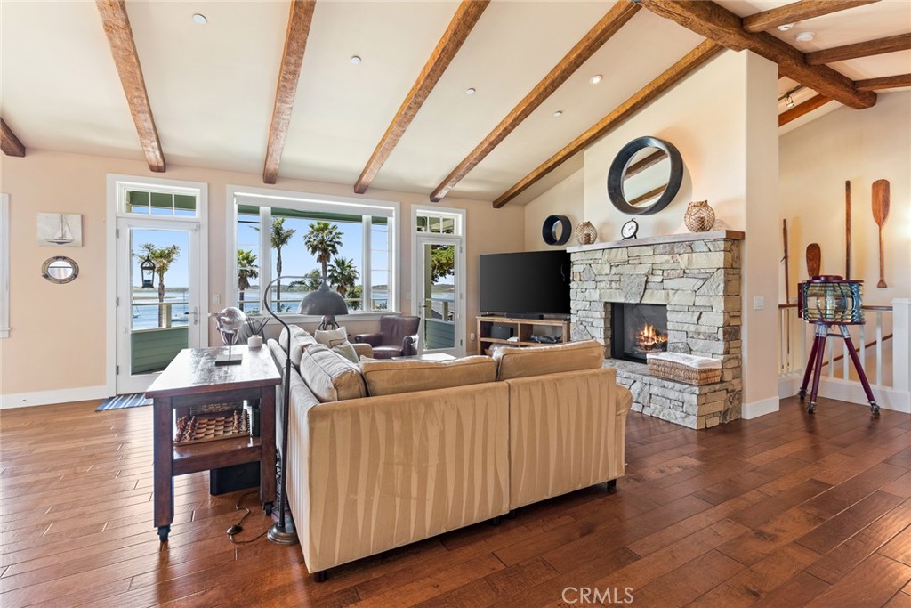 281 Main Street Morro Bay, CA 93442 - Photo 9 of 69 a living room with furniture a fireplace and a flat screen tv