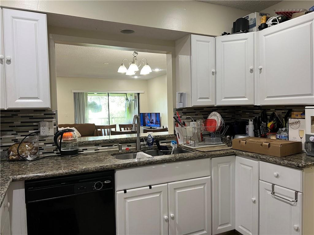 22415 Southwest 61st Way, Unit 202 Boca Raton, FL 33428 - Photo 2 of 22 Kitchen with Pass Through