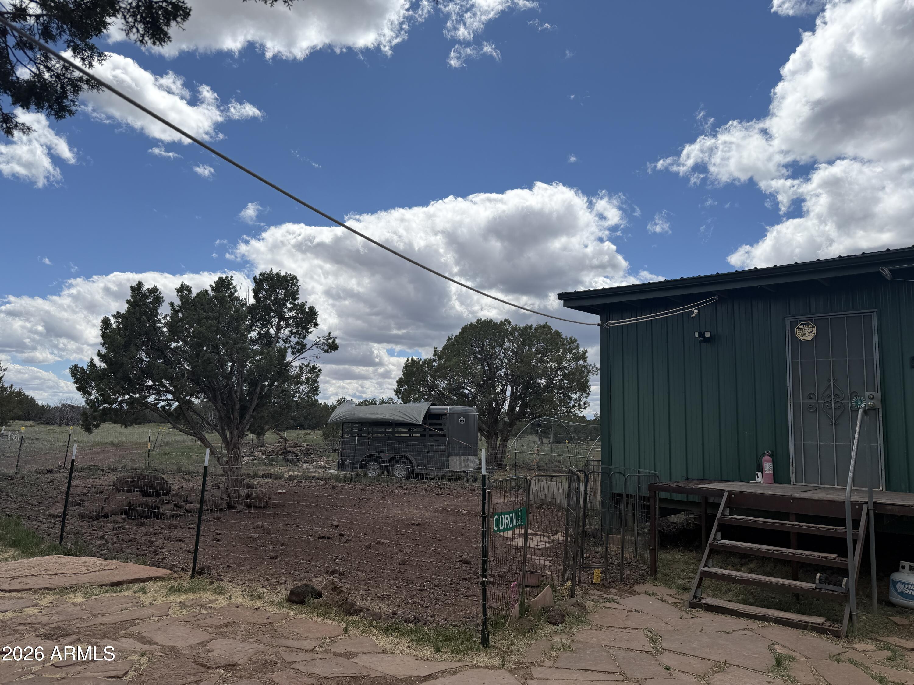 1 Hideaway Road Ash Fork, AZ 86320 - Photo 26 of 43 a front view of a house with a yard