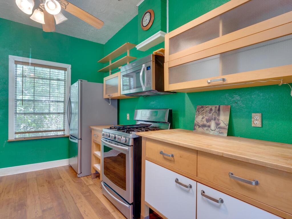 316 South Ave C, Unit B Elgin, TX 78621 - Photo 2 of 14 a kitchen with a cabinets and a stove