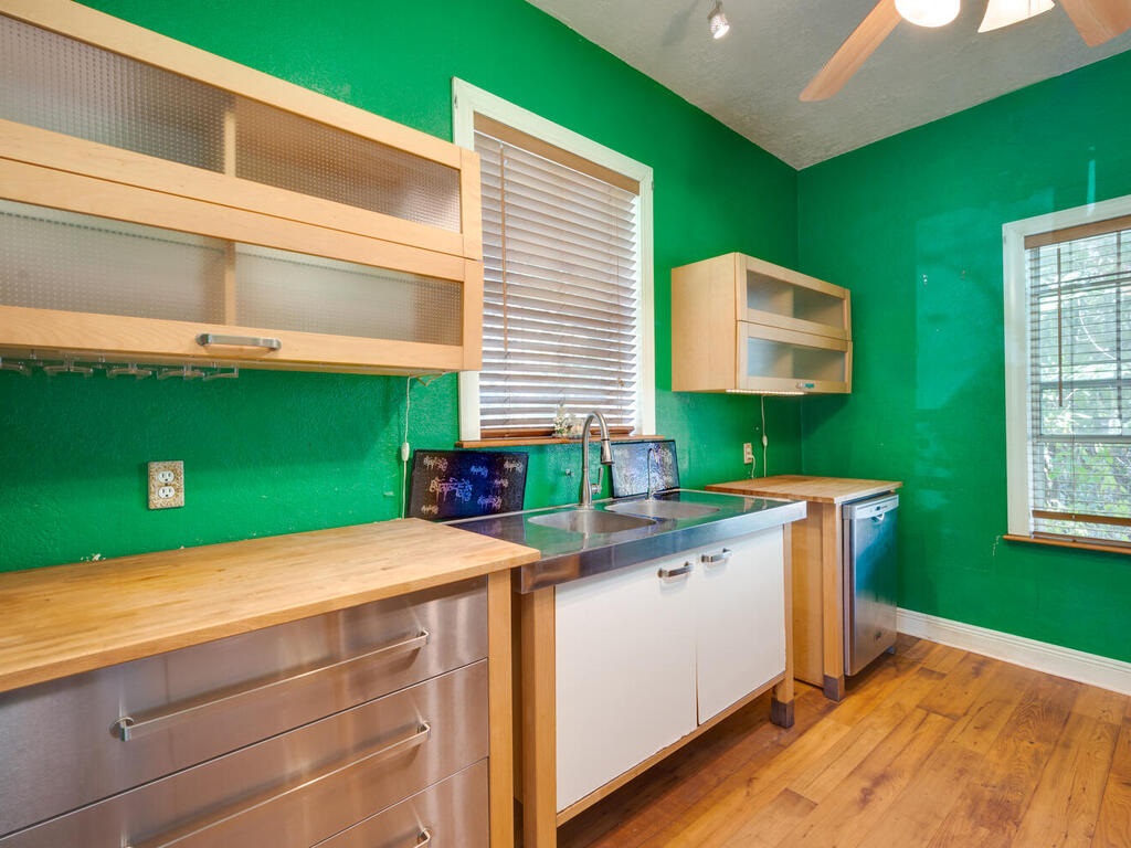 316 South Ave C, Unit B Elgin, TX 78621 - Photo 8 of 14 a kitchen with a sink and dishwasher