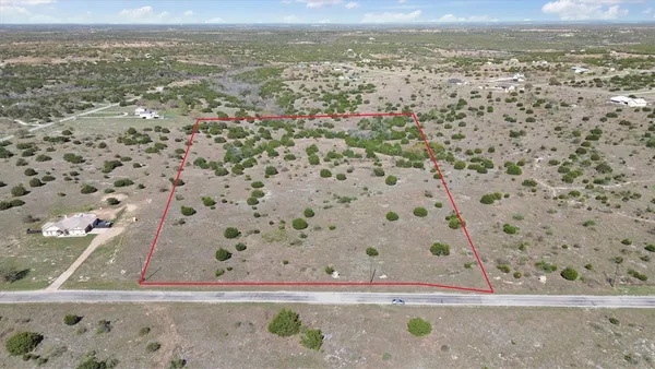 a view of a city of mountain and tree