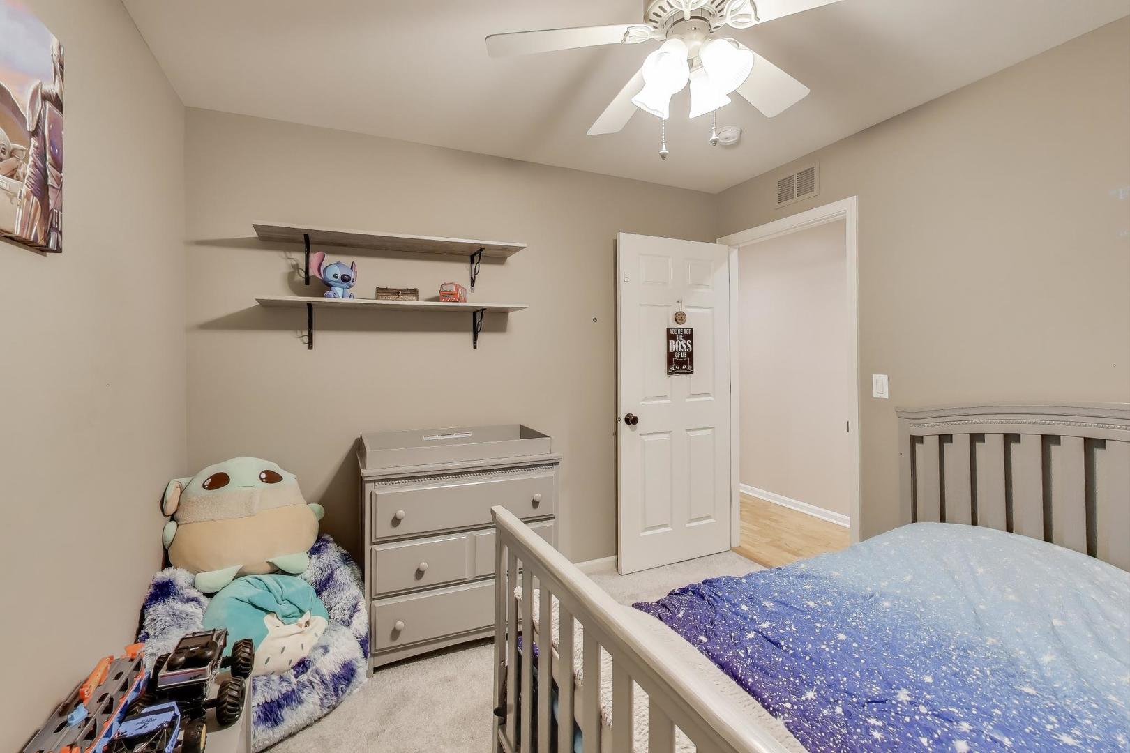 104 Waterbury Circle Oswego, IL 60543 - Photo 16 of 23 a view of a hallway to a livingroom with furniture