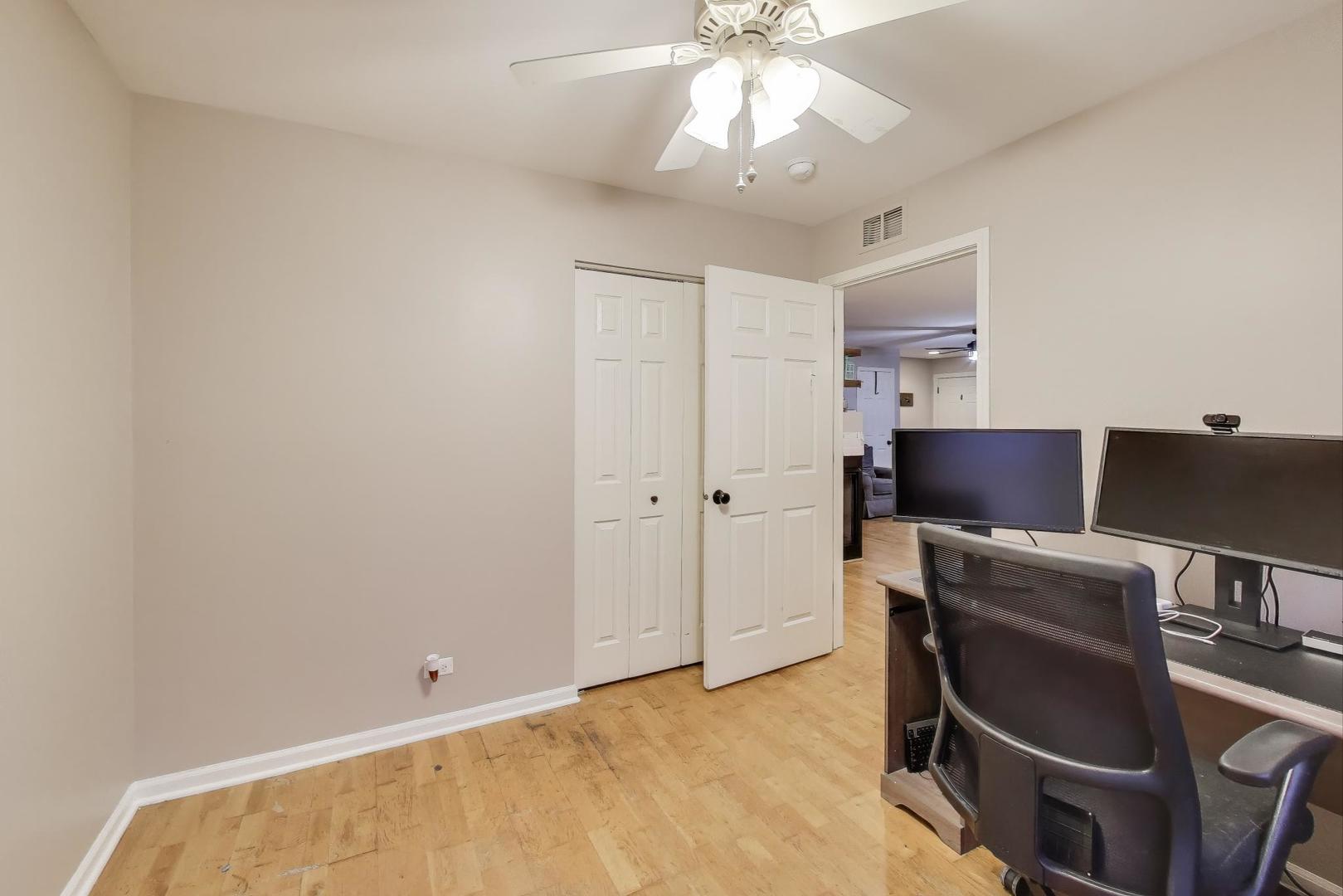 104 Waterbury Circle Oswego, IL 60543 - Photo 18 of 23 a view of workspace with wooden floor