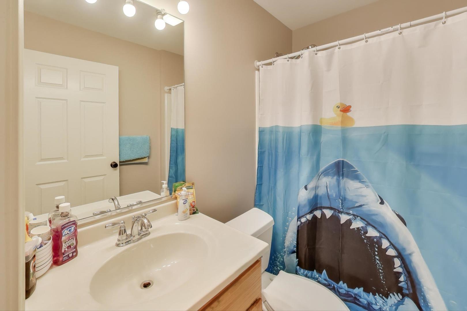 104 Waterbury Circle Oswego, IL 60543 - Photo 19 of 23 a bathroom with a sink vanity mirror and tub