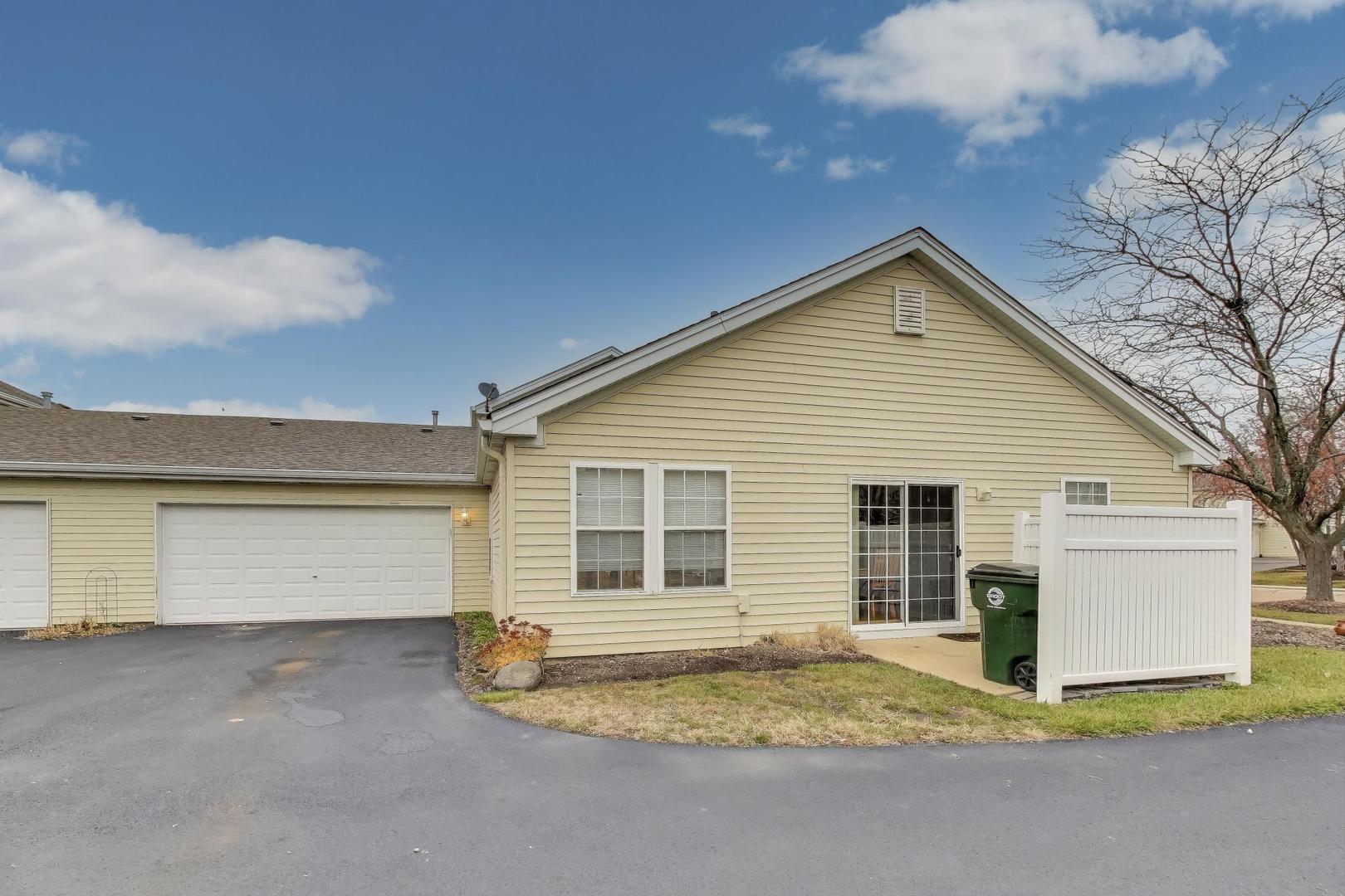 104 Waterbury Circle Oswego, IL 60543 - Photo 22 of 23 a view of backyard of house