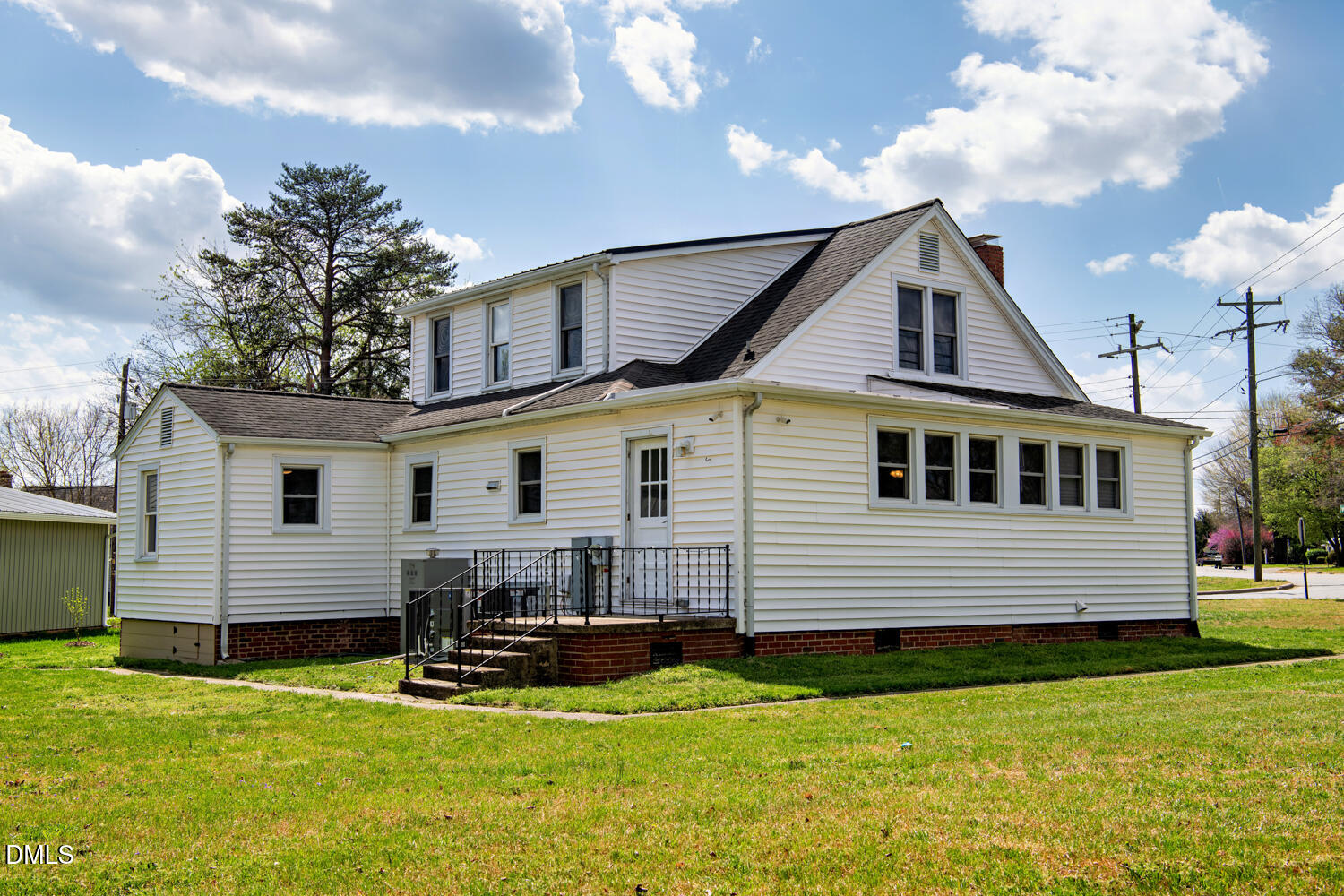 414 South Maple Street Graham, NC 27253 - Photo 25 of 42 a front view of a house with a yard