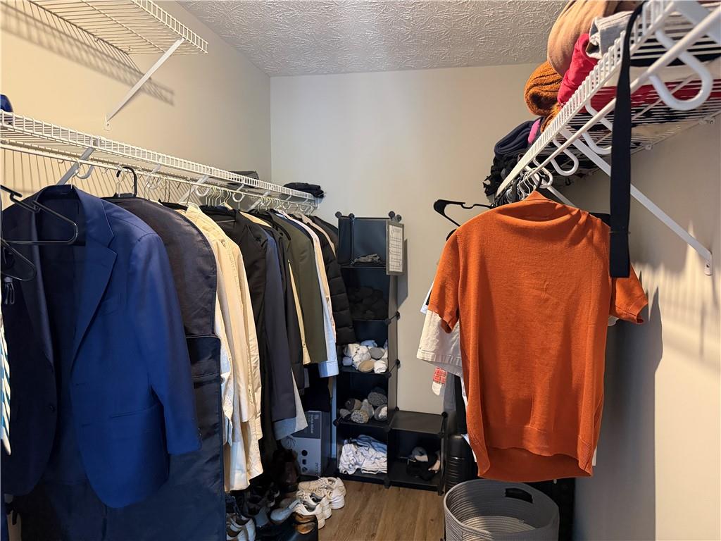 934 Bay Ridge Drive Lawrenceville, GA 30045 - Photo 62 of 78 a view of walk in closet with clothes and shoes