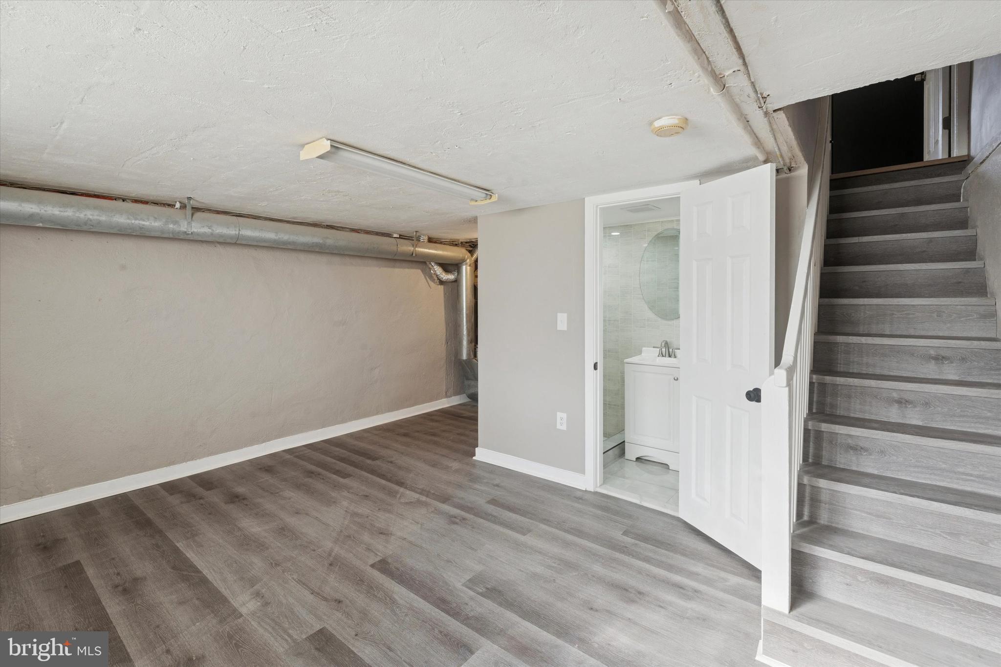6340 Cardiff Street Philadelphia, PA 19149 - Photo 16 of 20 a view of a livingroom with wooden floor and staircase