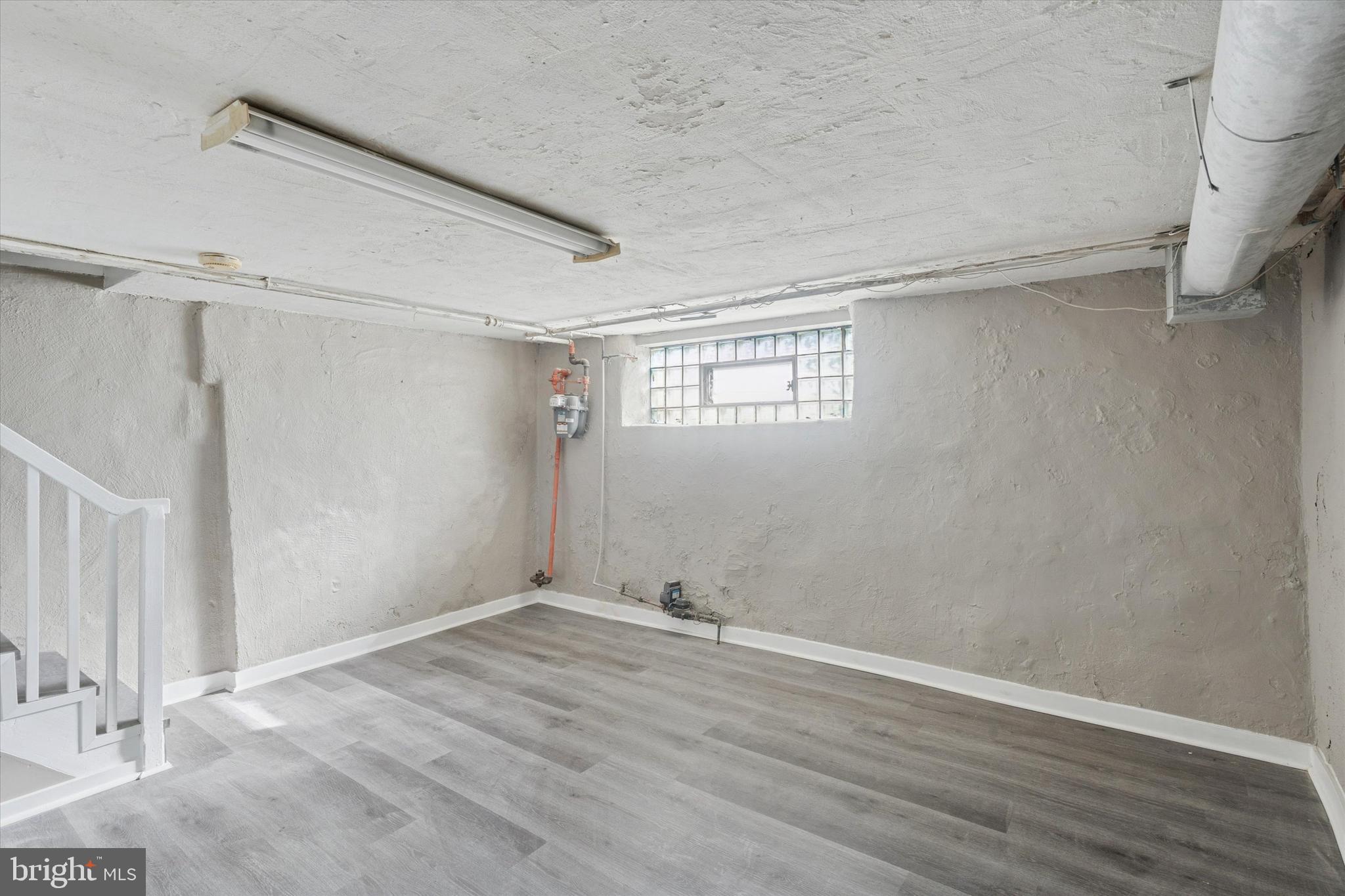 6340 Cardiff Street Philadelphia, PA 19149 - Photo 18 of 20 a view of an empty room with wooden floor and a window