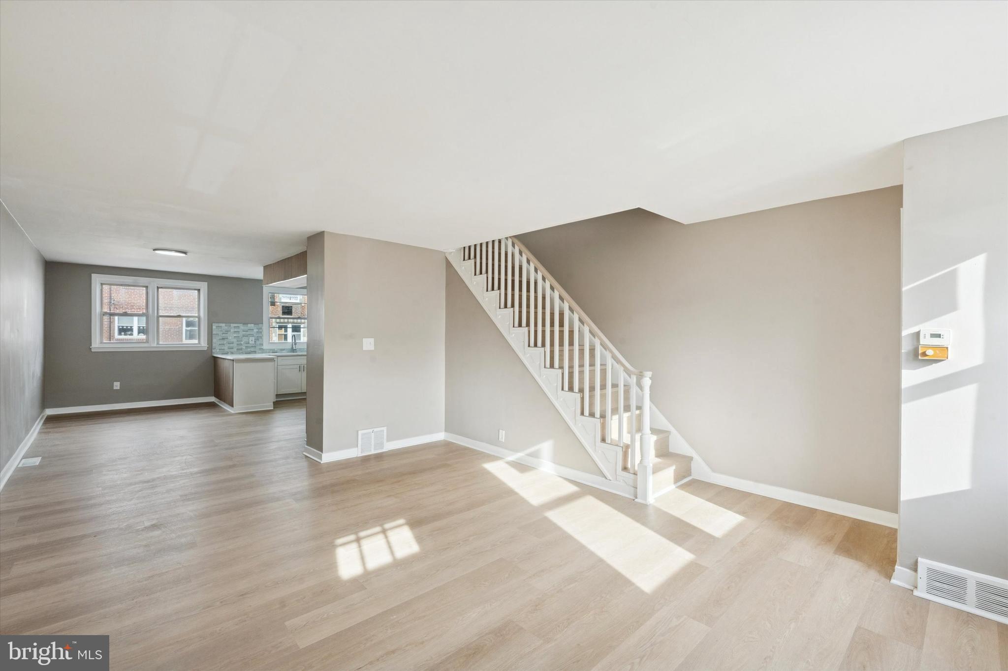 6340 Cardiff Street Philadelphia, PA 19149 - Photo 2 of 20 a view of a livingroom with wooden floor and stairs
