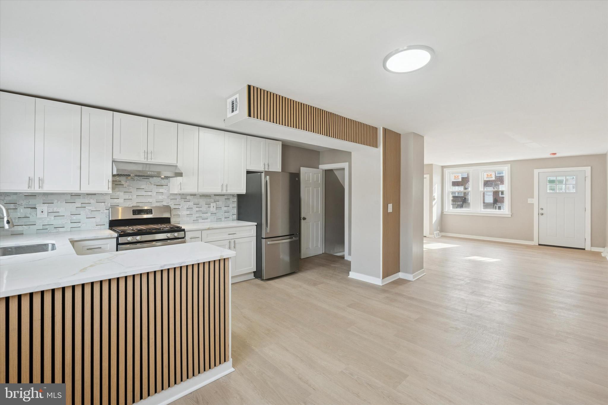 6340 Cardiff Street Philadelphia, PA 19149 - Photo 5 of 20 a kitchen with stainless steel appliances granite countertop a refrigerator and a stove