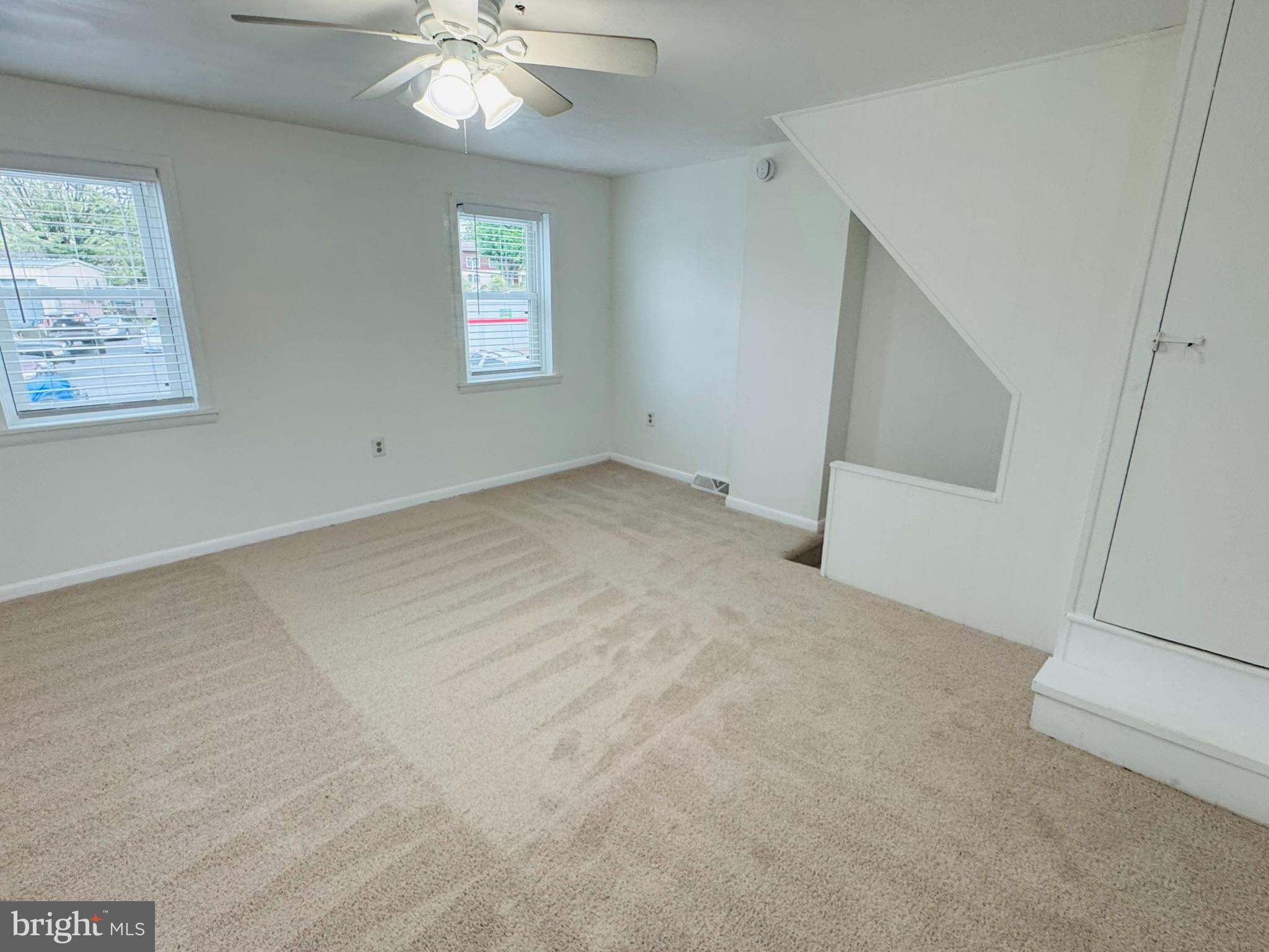 25 Degrange Street Frederick, MD 21701 - Photo 11 of 19 an empty room with windows and chandelier fan