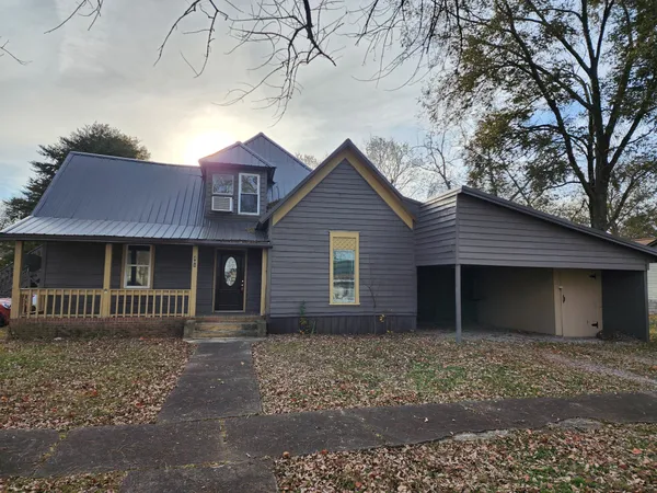 a house view with a garden space