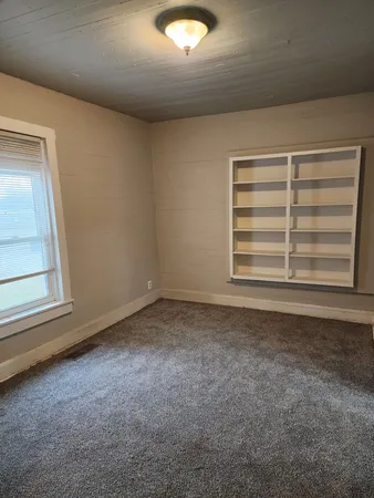a view of a room that has a window in it