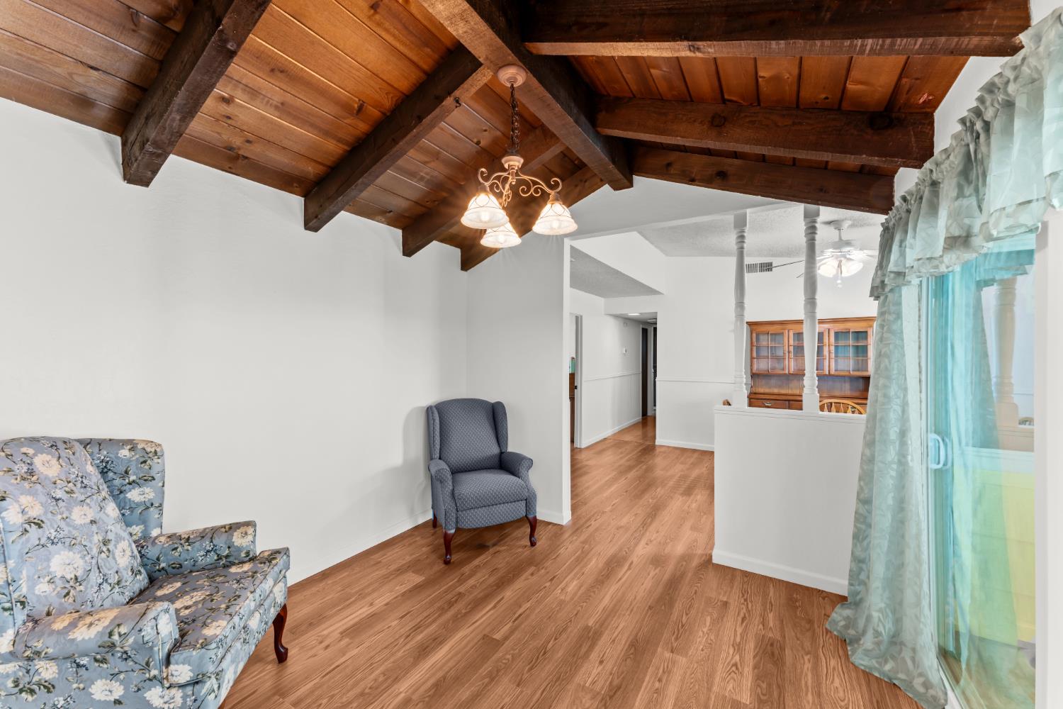 3395 Meadow Way Rocklin, CA 95677 - Photo 12 of 35 a living room with furniture and a wooden floor