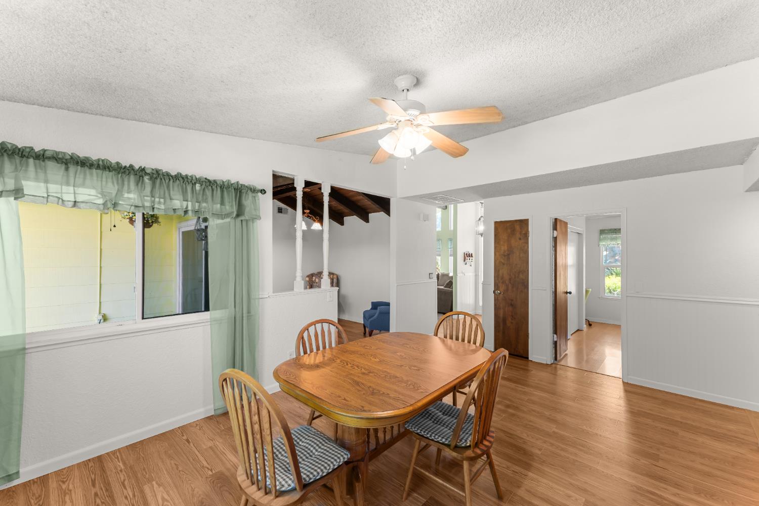 3395 Meadow Way Rocklin, CA 95677 - Photo 16 of 35 a view of a dining room with furniture and wooden floor
