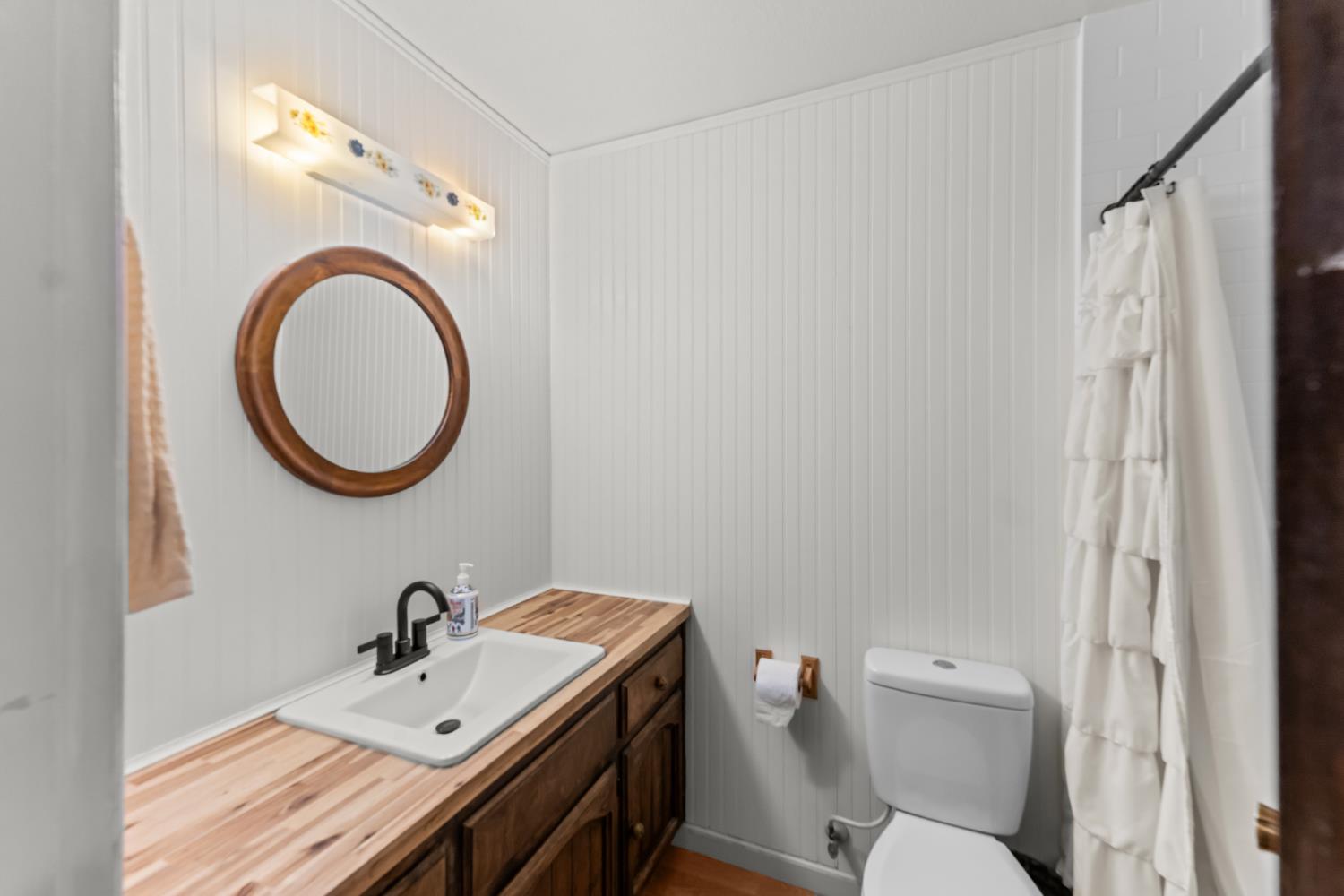 3395 Meadow Way Rocklin, CA 95677 - Photo 19 of 35 a bathroom with a sink and a mirror