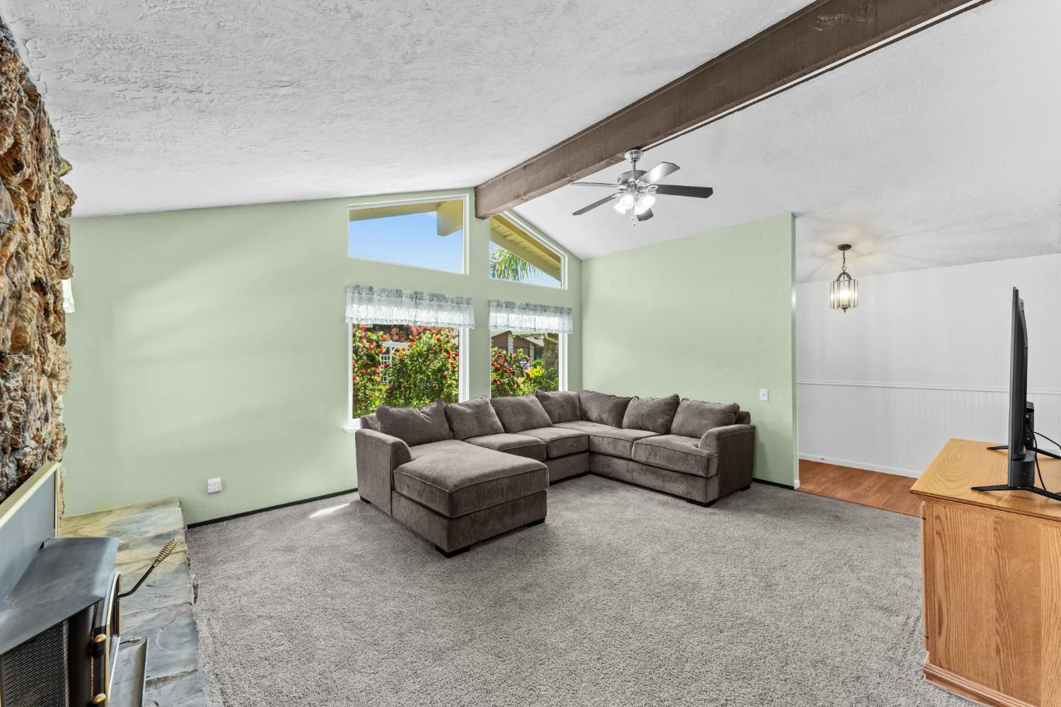 3395 Meadow Way Rocklin, CA 95677 - Photo 2 of 35 a living room with furniture and a flat screen tv