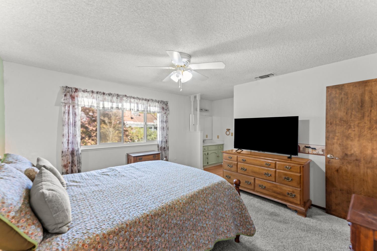 3395 Meadow Way Rocklin, CA 95677 - Photo 22 of 35 a bedroom with bed and flat screen tv