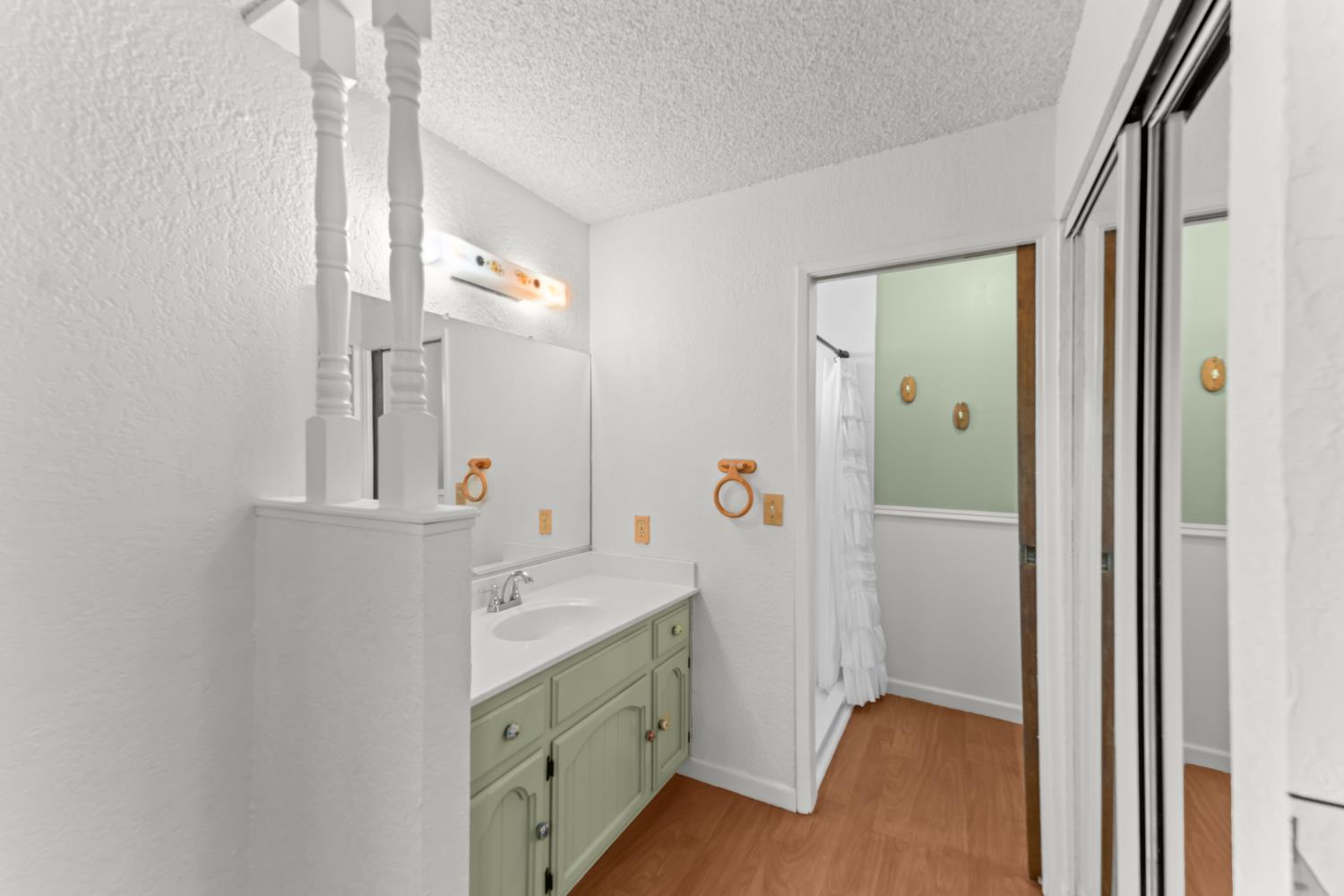 3395 Meadow Way Rocklin, CA 95677 - Photo 23 of 35 a bathroom with a double vanity sink and mirror