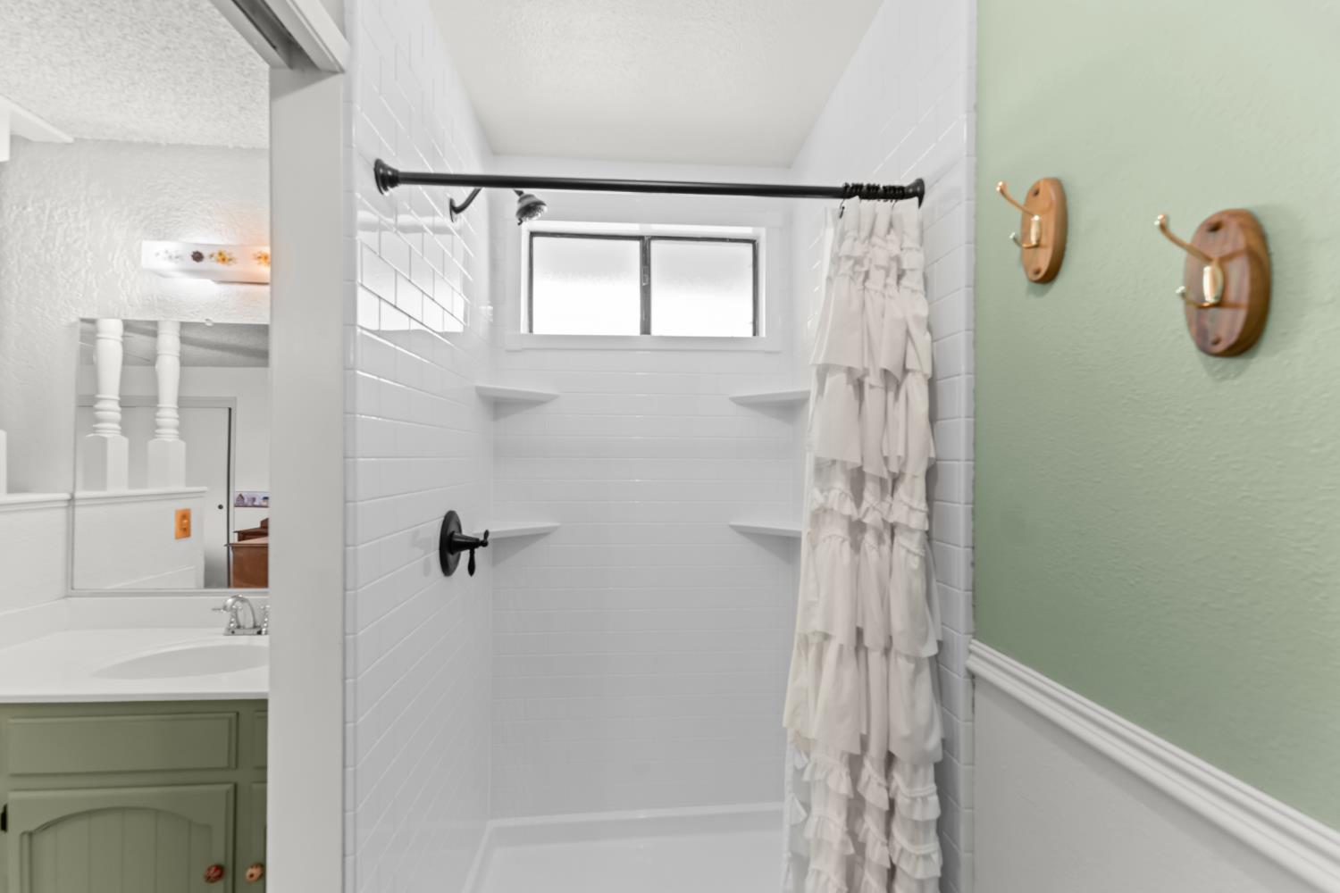 3395 Meadow Way Rocklin, CA 95677 - Photo 24 of 35 a bathroom with a shower and a sink