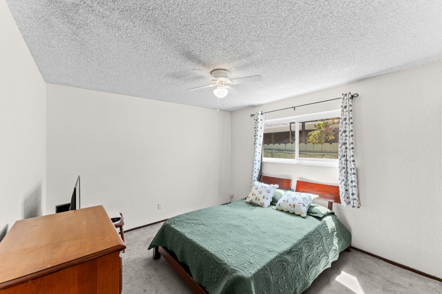 3395 Meadow Way Rocklin, CA 95677 - Photo 25 of 35 a bedroom with a bed and a window