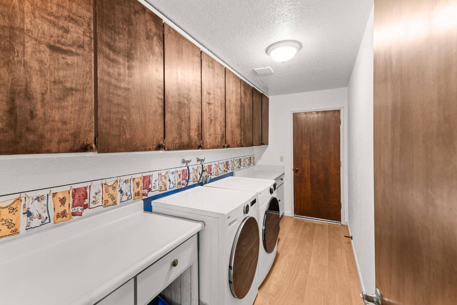 3395 Meadow Way Rocklin, CA 95677 - Photo 27 of 35 a utility room with dryer and washer