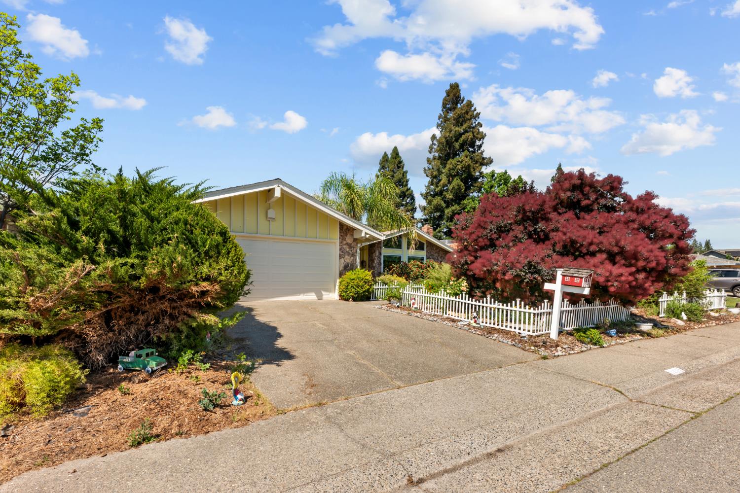 3395 Meadow Way Rocklin, CA 95677 - Photo 32 of 35 a wooden bench with a flower plants
