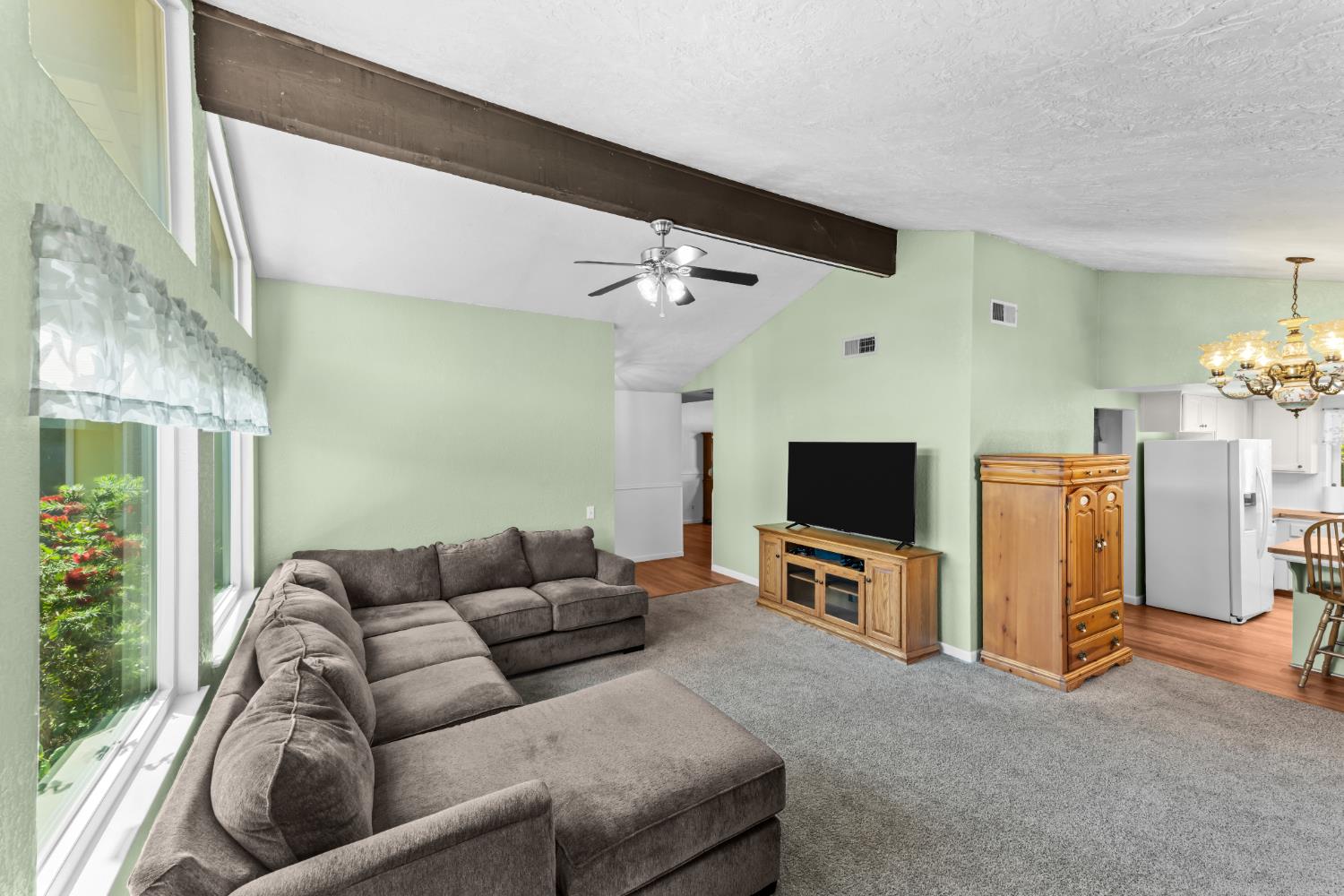 3395 Meadow Way Rocklin, CA 95677 - Photo 4 of 35 a living room with furniture and a flat screen tv