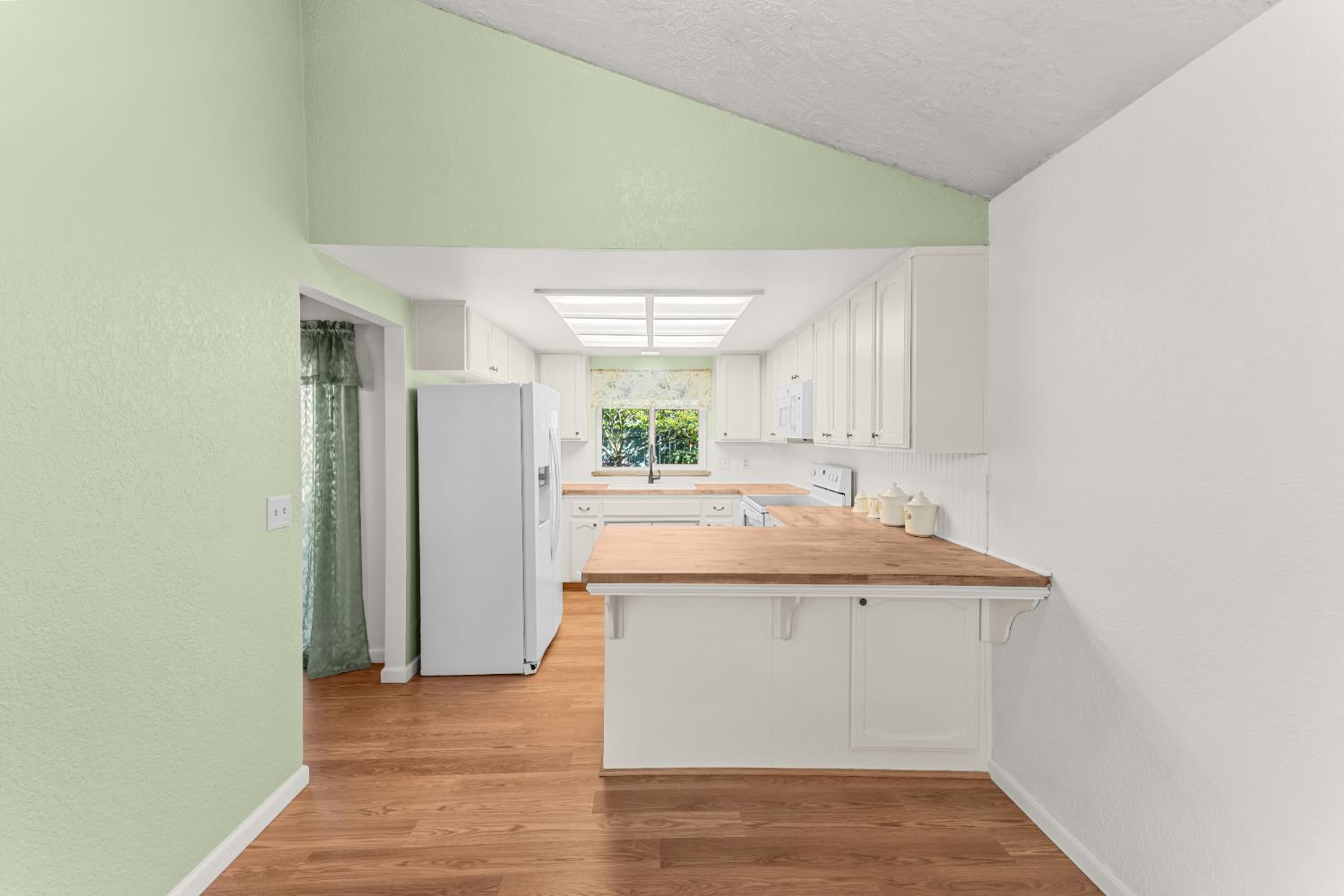 3395 Meadow Way Rocklin, CA 95677 - Photo 5 of 35 a room with a sink and a refrigerator