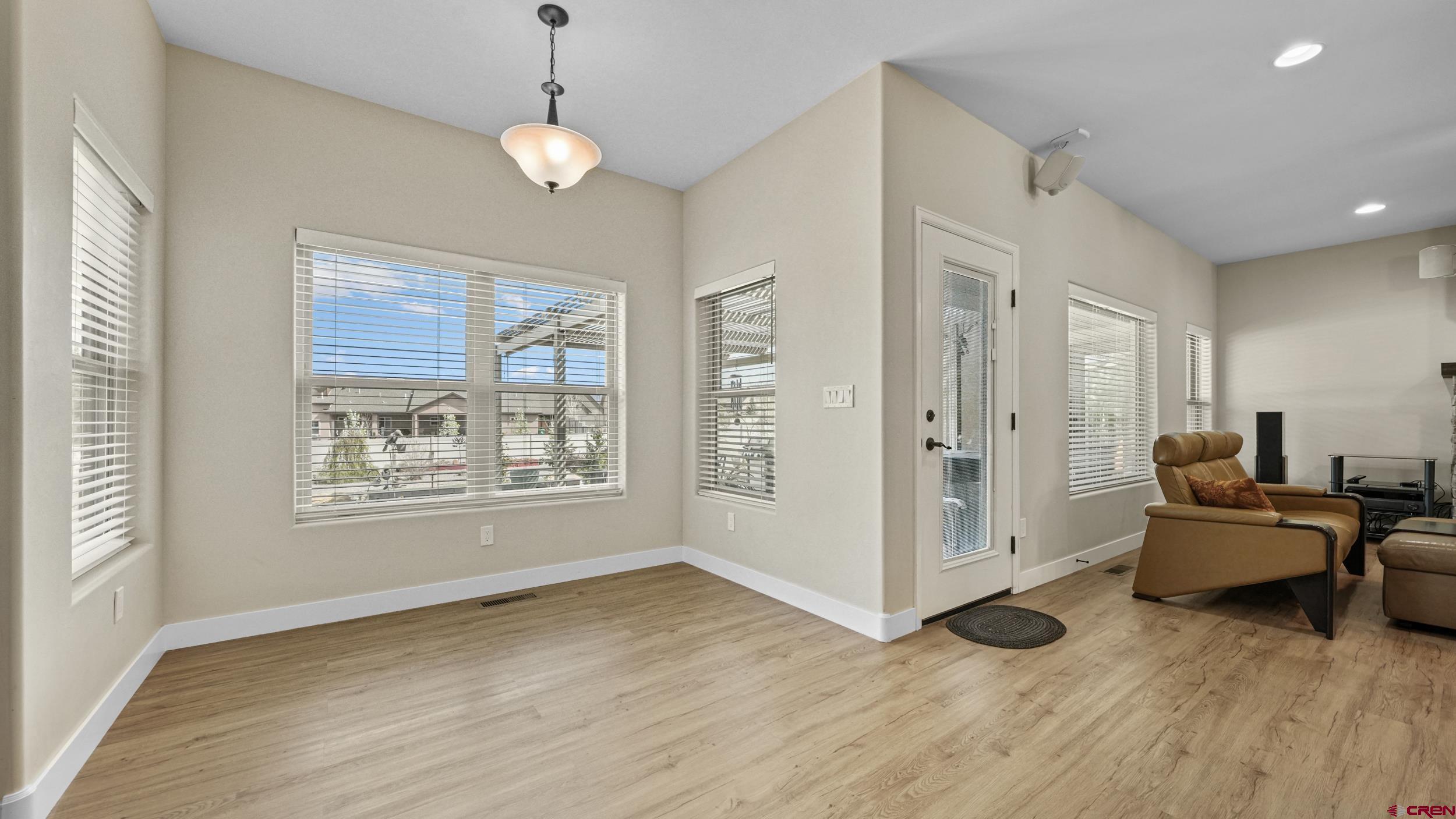 2042 Constitution Loop Montrose, CO 81401 - Photo 12 of 42 a living room with furniture and a window