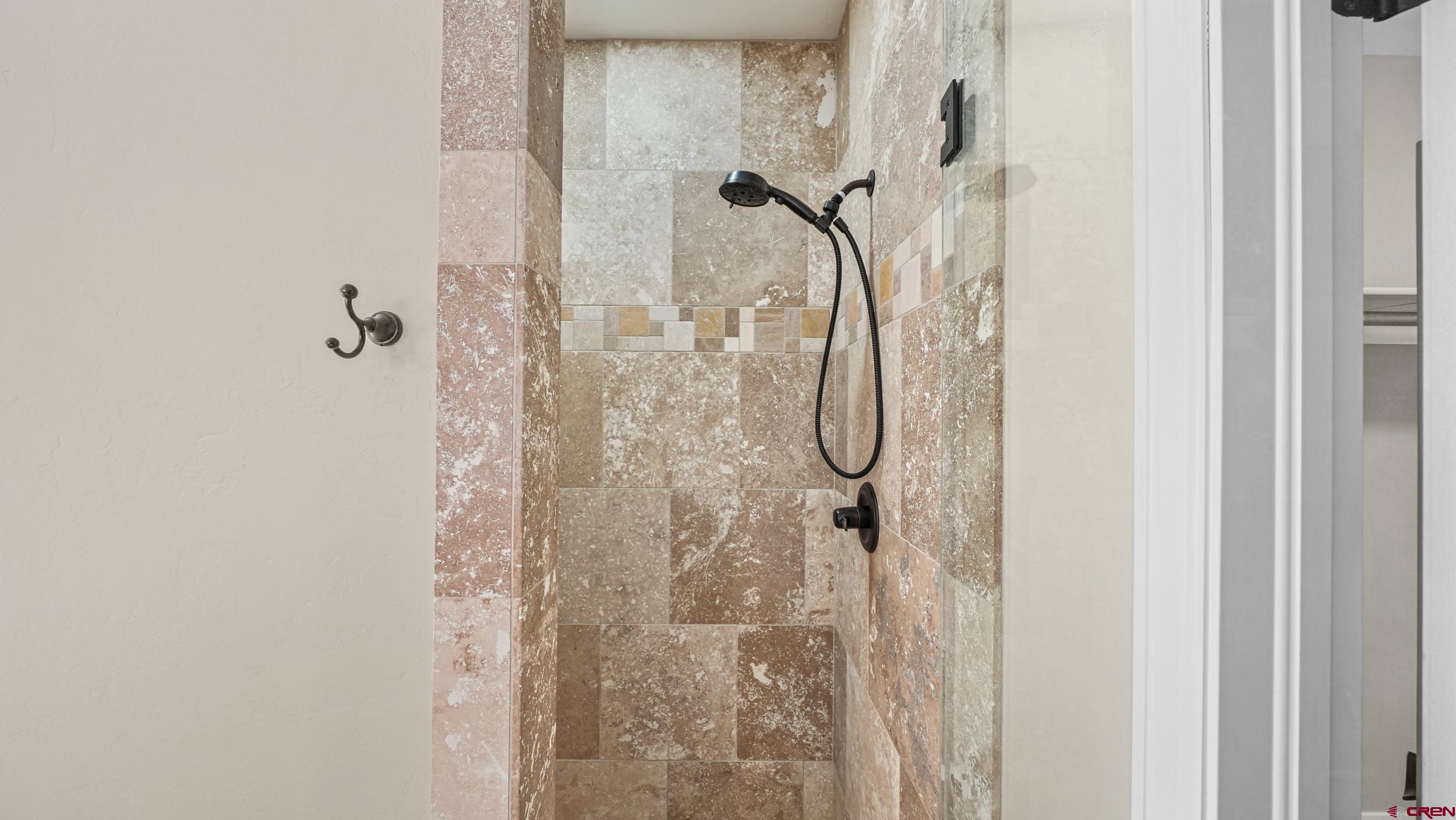 2042 Constitution Loop Montrose, CO 81401 - Photo 18 of 42 a bathroom with a shower