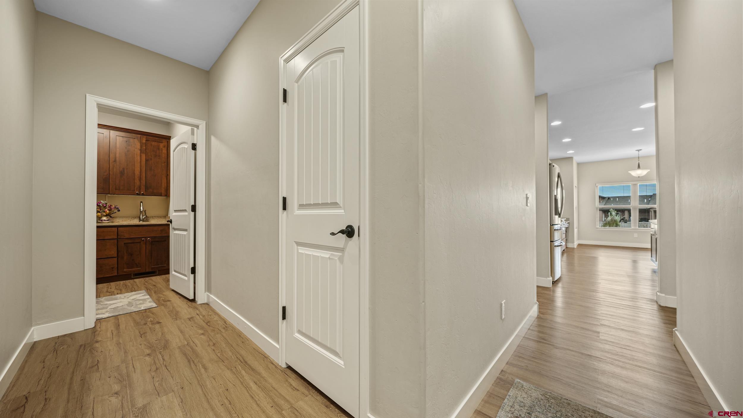 2042 Constitution Loop Montrose, CO 81401 - Photo 23 of 42 a view of a hallway with wooden floor