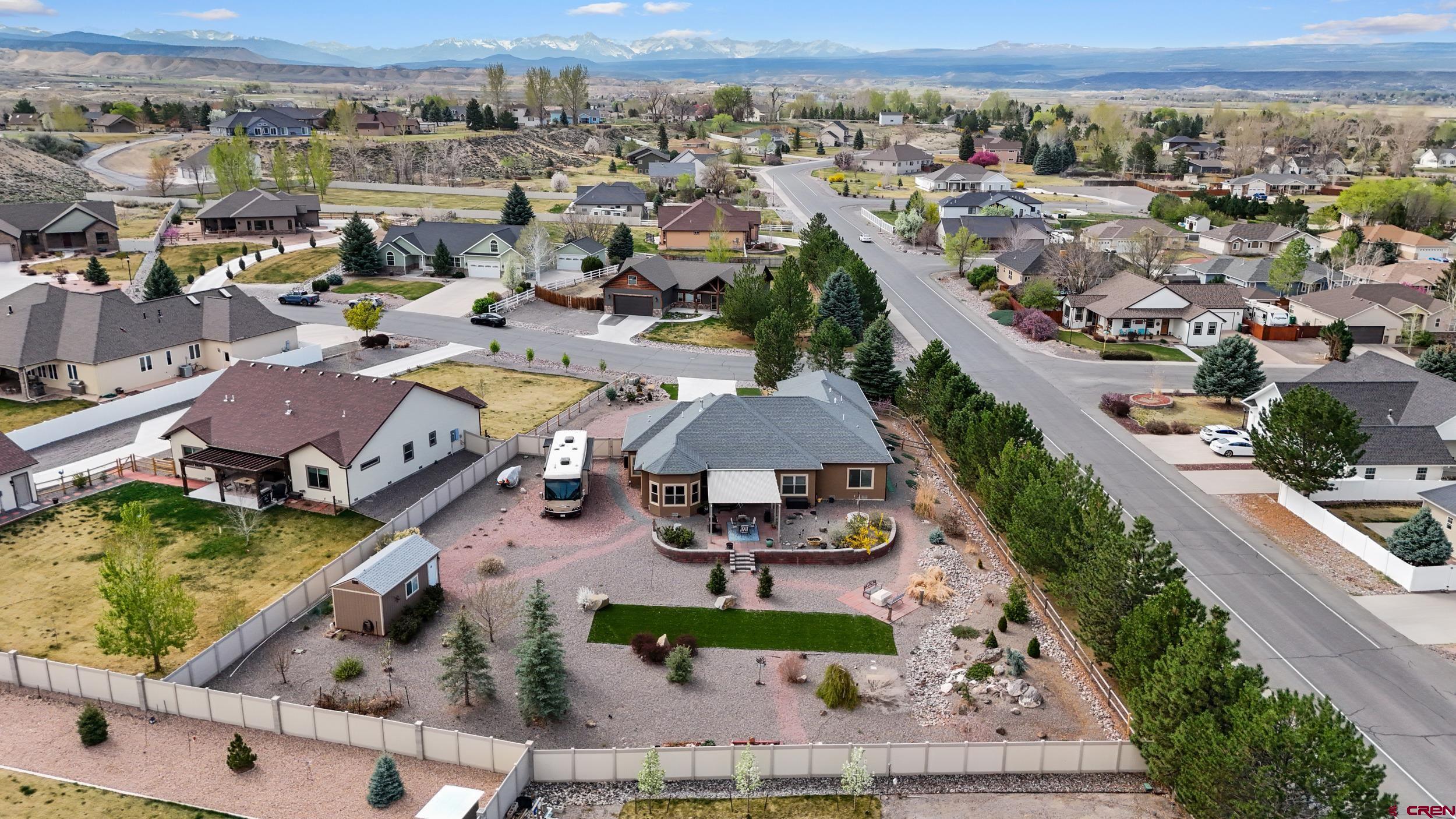 2042 Constitution Loop Montrose, CO 81401 - Photo 42 of 42 an aerial view of a swimming pool patio and mountain view