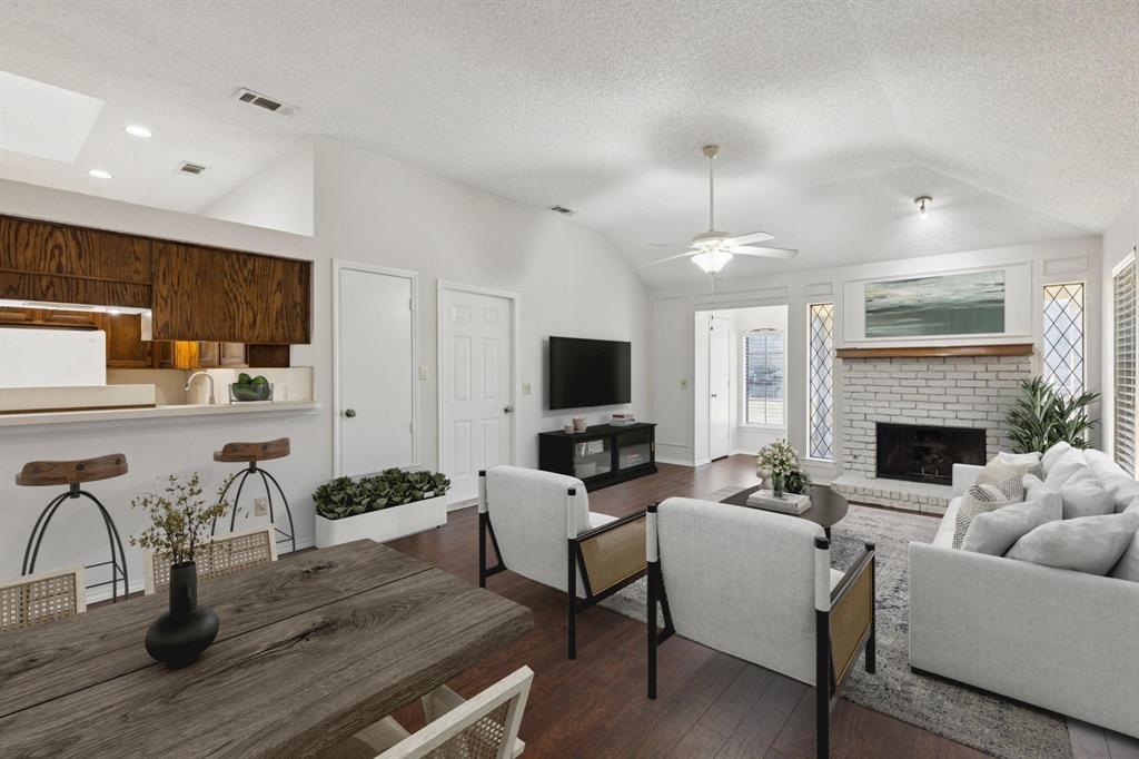 Beautiful updated paint! Lovely wood like laminate throughout living and dining. Woodburning fireplace with gas starter for a cozy atmosphere. Virtually staged