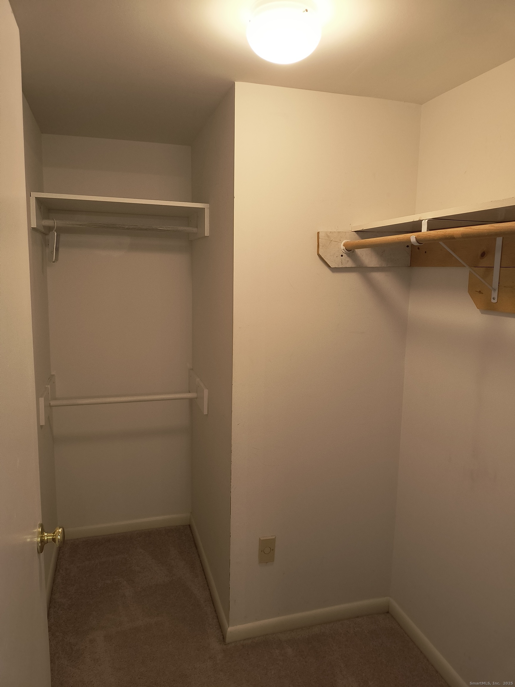 a view of a room with racks on the wall