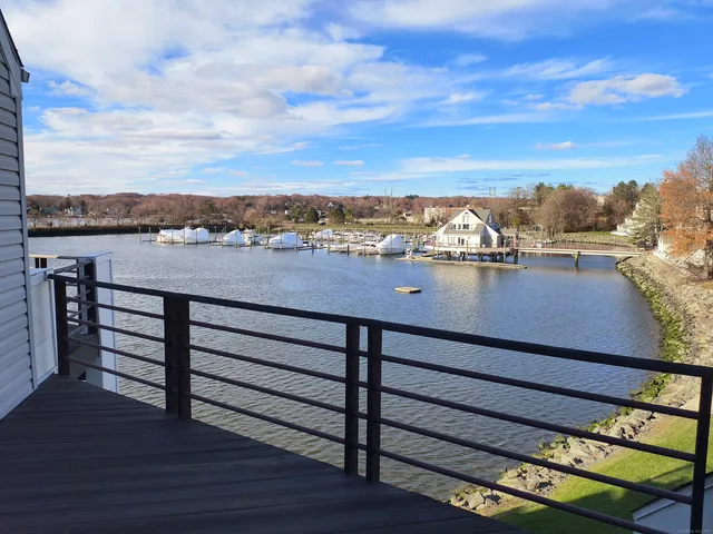 a view of a terrace with wooden floor and a city view