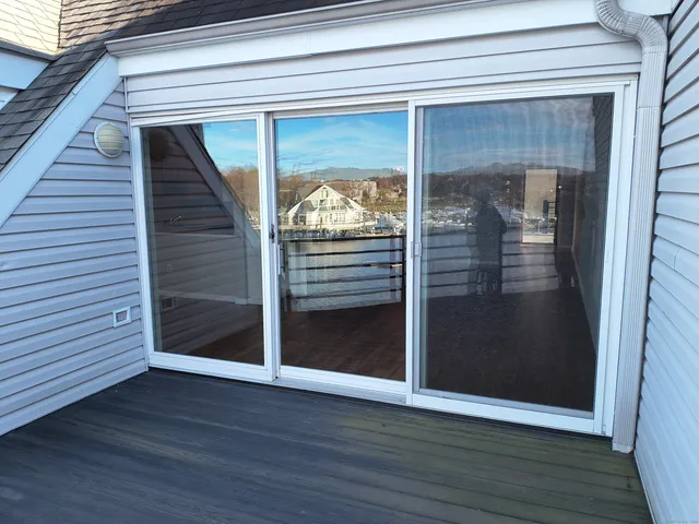 a view of a livingroom with wooden floor and door